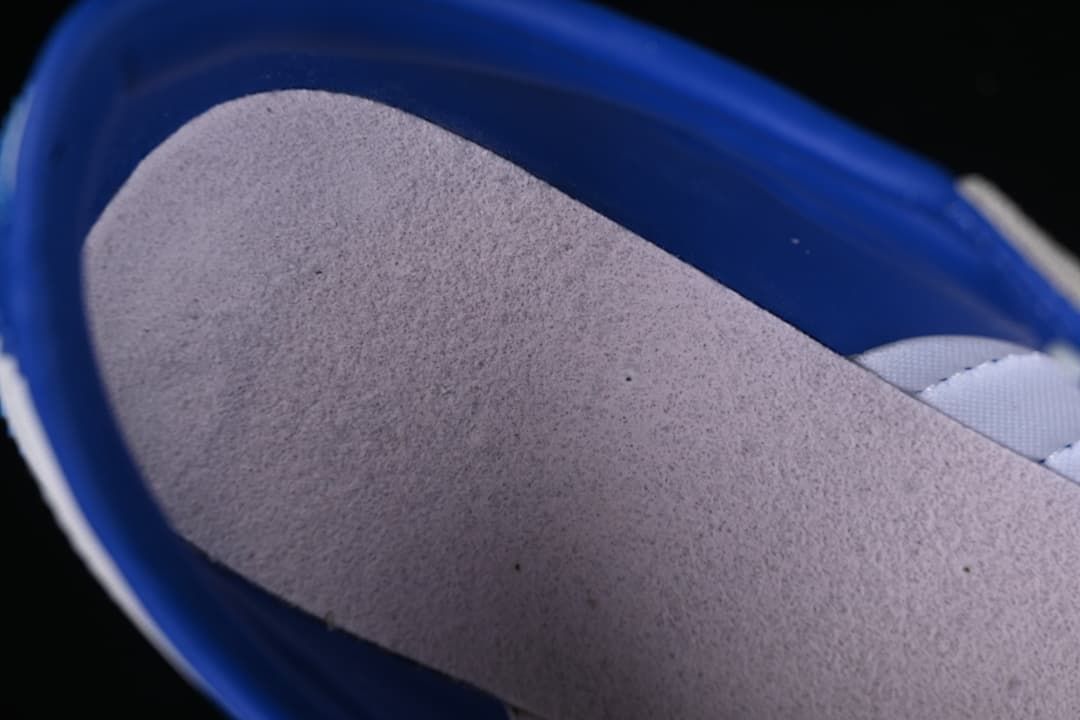 Close-up of the grey lining and blue interior of the sneaker