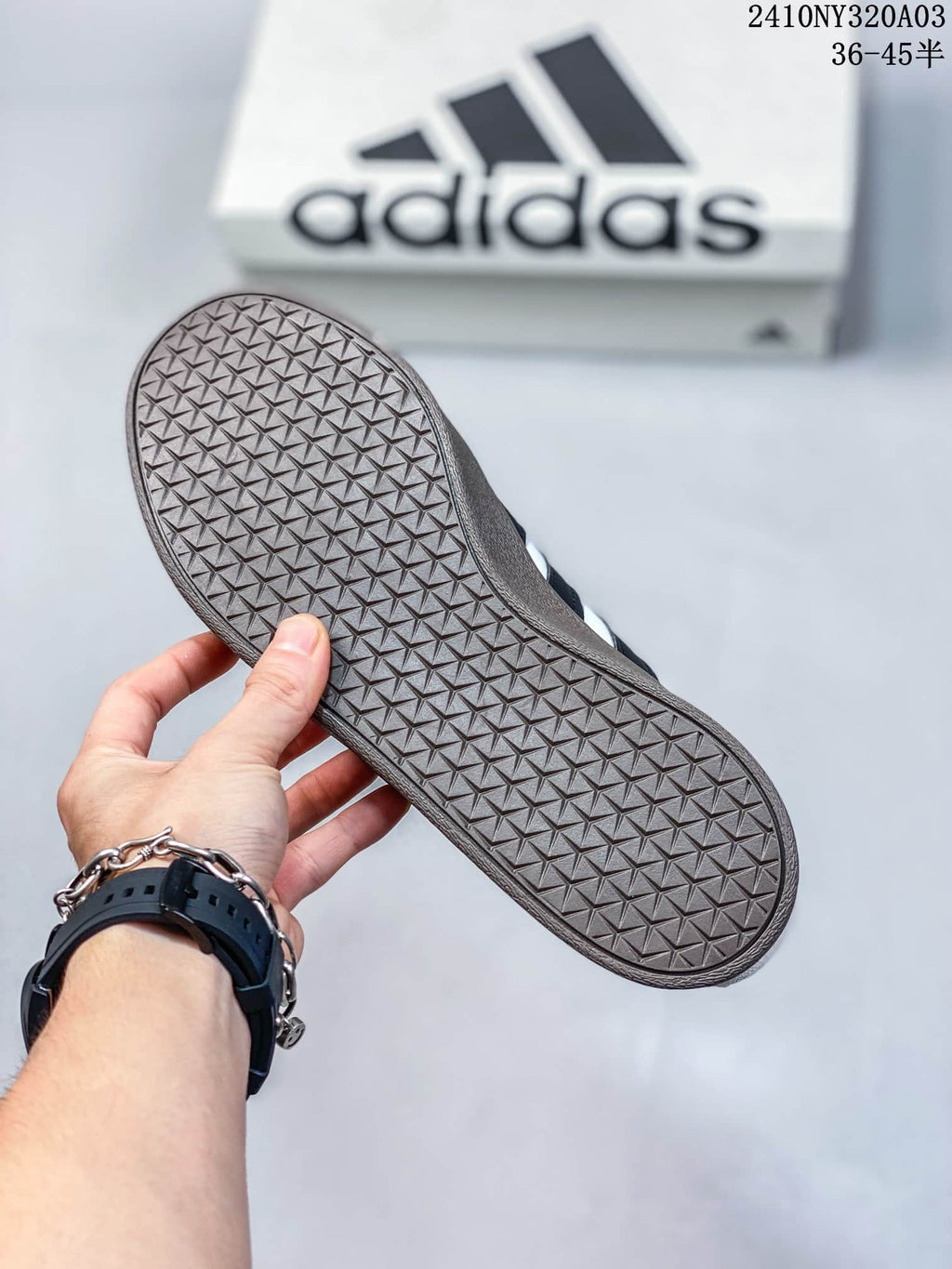 Close-up of the sneaker's dark gum-colored outsole with a geometric tread pattern.