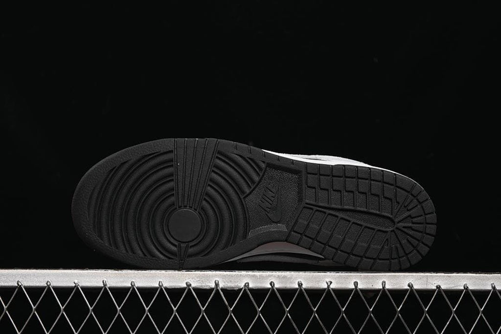 Underside view of the black rubber outsole and tread pattern