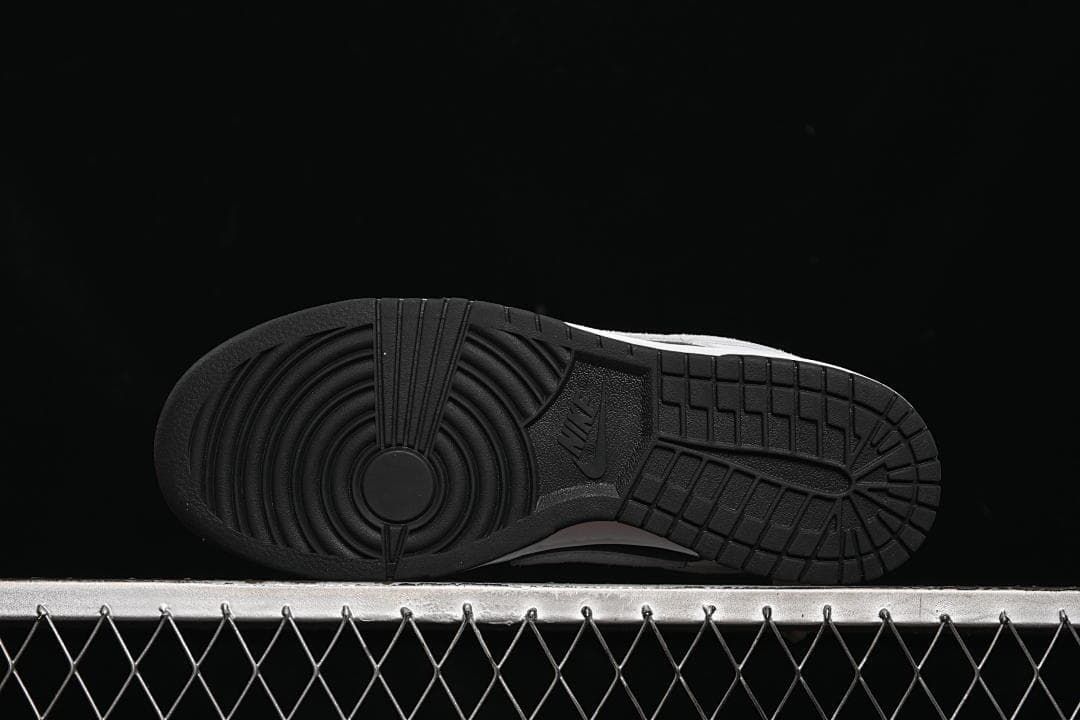 Underside view of the black rubber outsole and tread pattern