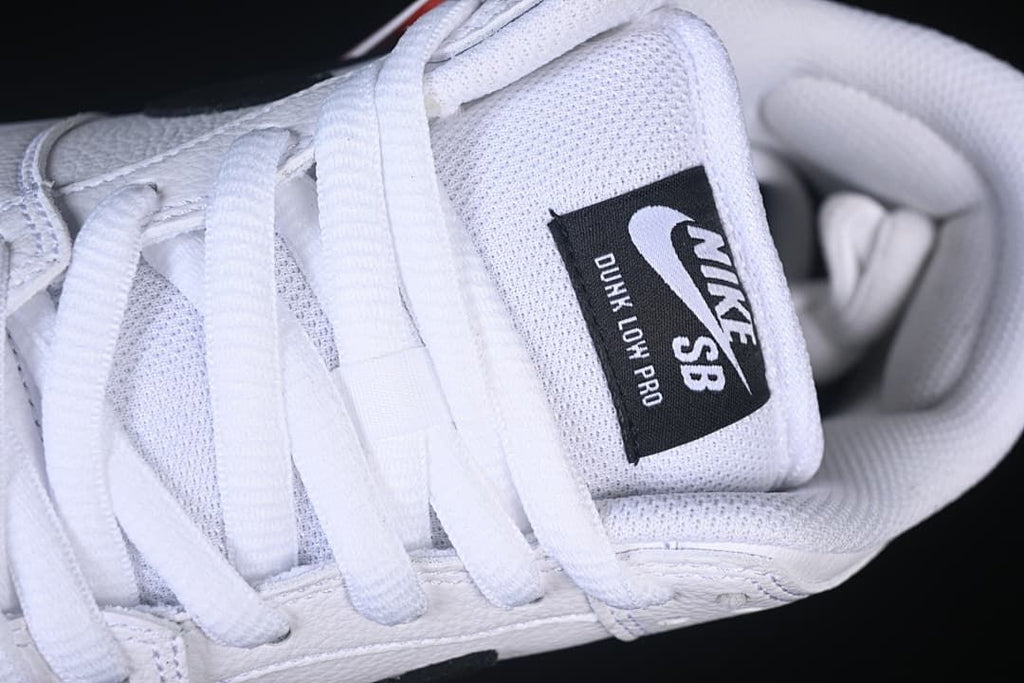 Close-up of the Nike SB Dunk Low Pro tongue label and white laces