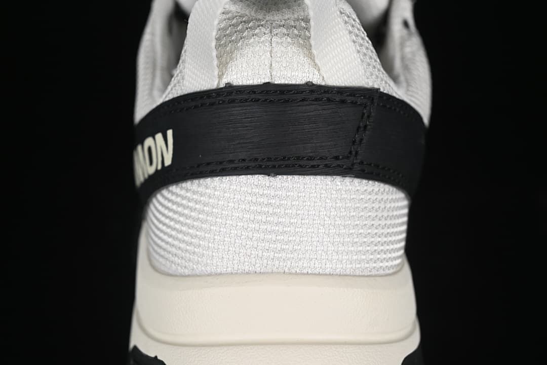 Rear view of the sneaker showing its heel strap and layered sole