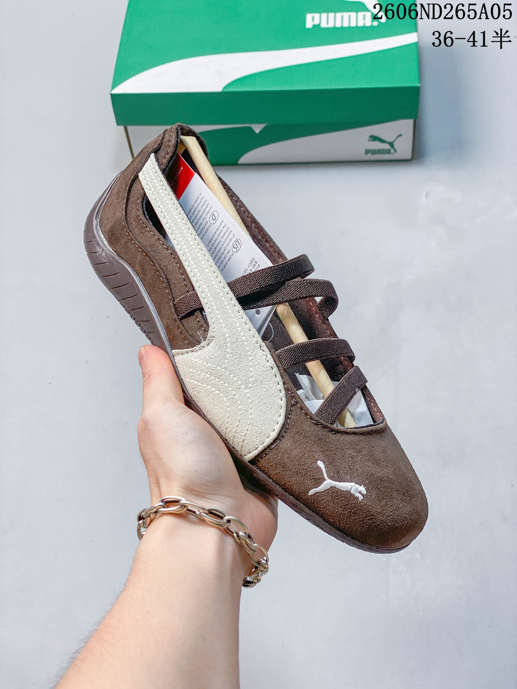 Angled view of a brown PUMA Speedcat Ballet shoe with a cream side stripe