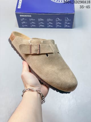 Beige suede closed-toe clog with a matching metal buckle, shown with its branded box.