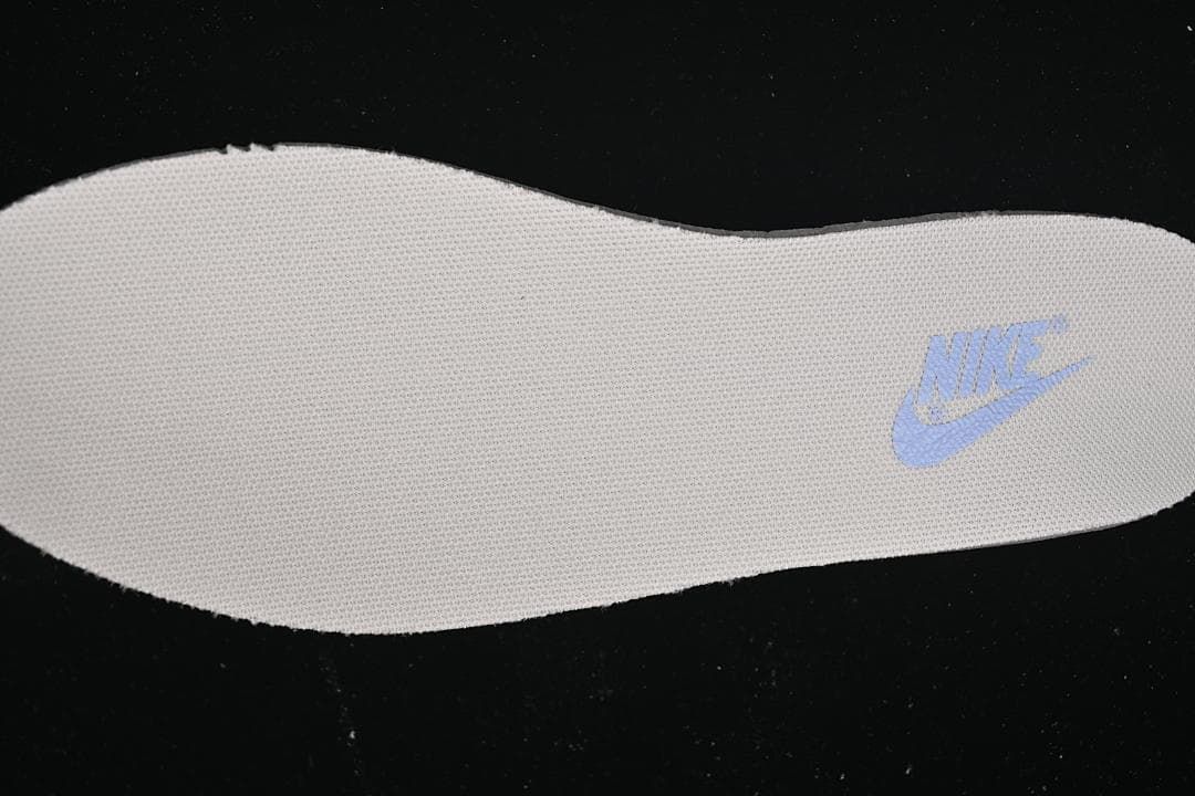 Close-up of the light blue Nike logo on the insole