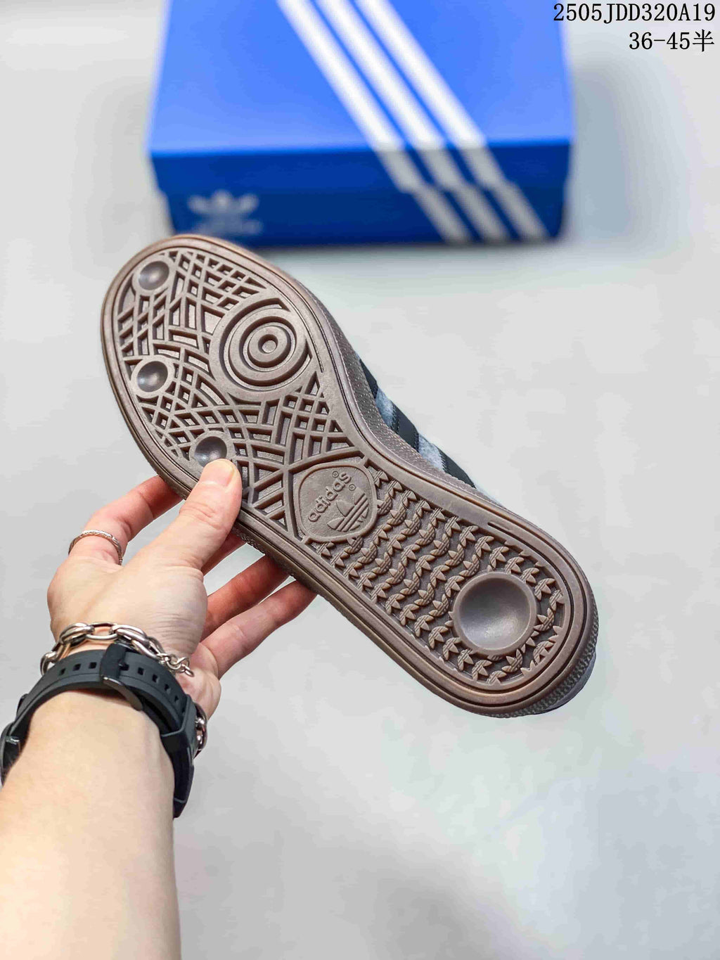 Close-up of the patterned gum-colored outsole on a grey sneaker.