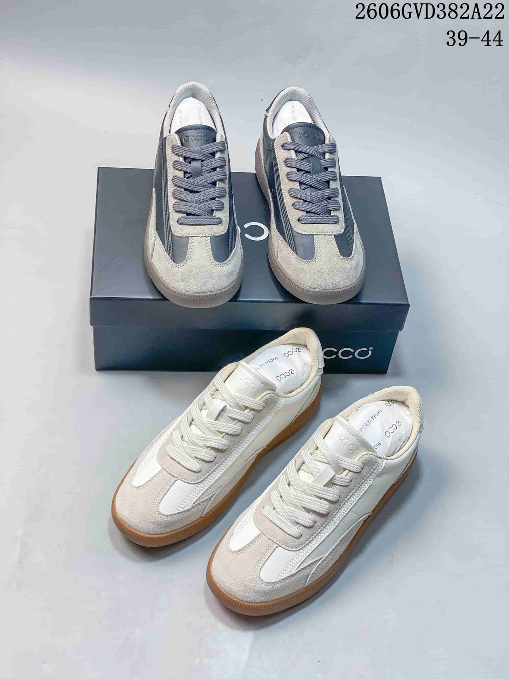 Two colorways of ECCO low-top lace-up sneakers: gray and dark blue, and off-white with gum-colored soles.