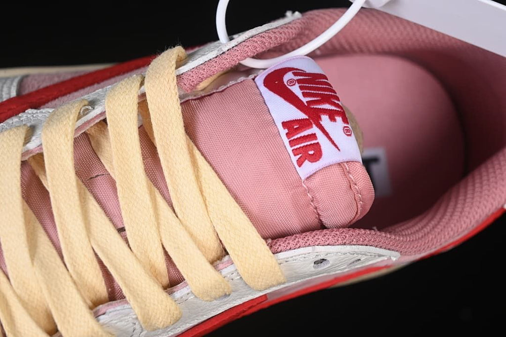 Top detail of tongue label, lining, and cream laces