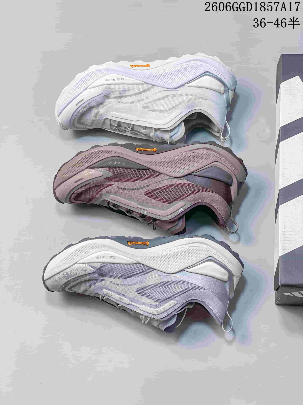 Outsole and side views of white, muted pink and lavender-gray adidas HOLO PEAK shoes.