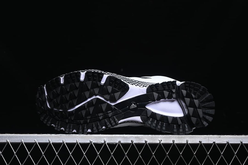 Underside view showing the black lugged outsoles