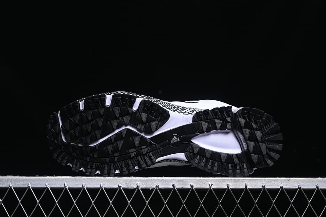 Underside view showing the black lugged outsoles