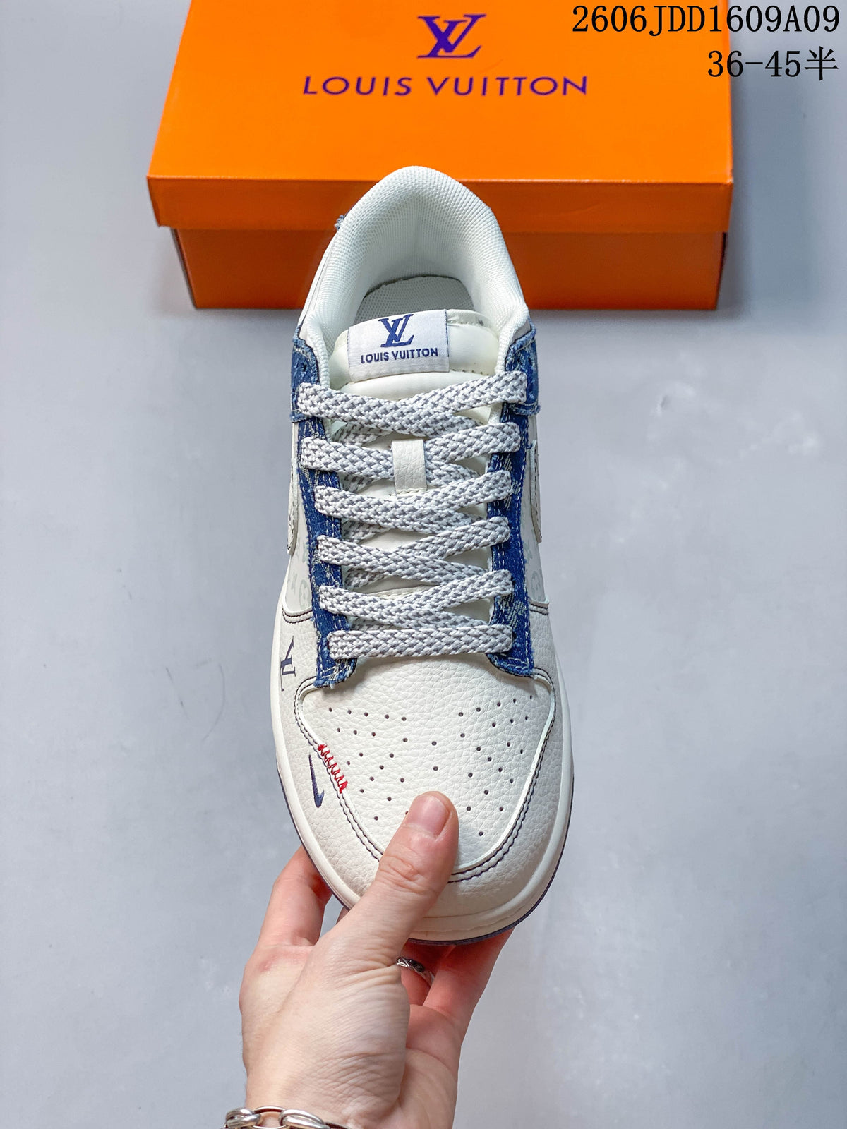 Top view of the sneaker showing laces, perforated toe, and blue patterned panels