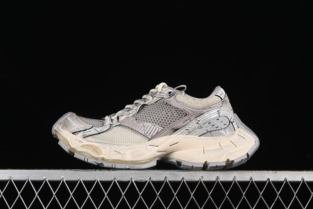 Side view of a beige and grey Balenciaga Stapler sneaker