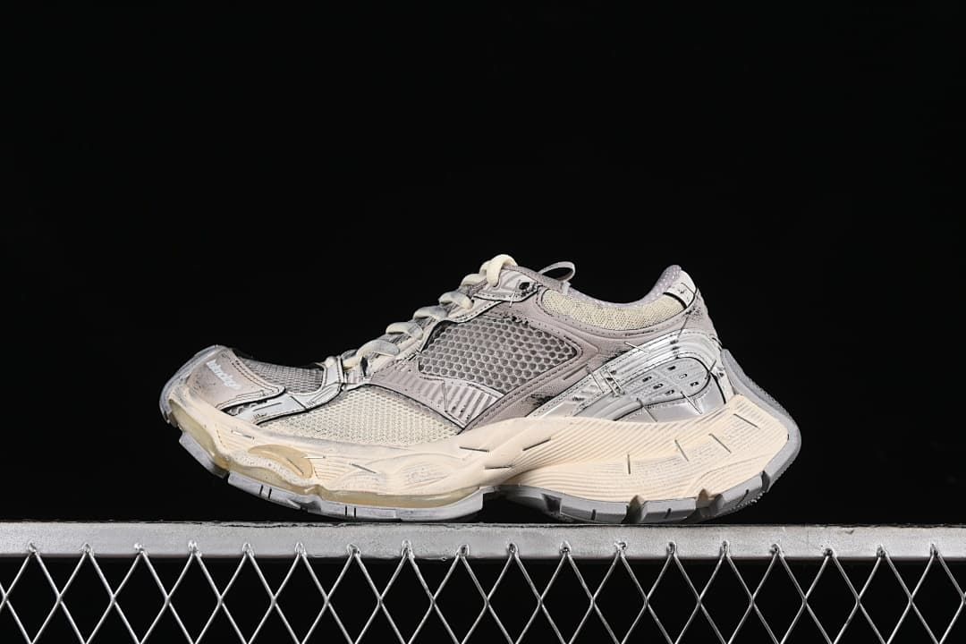Side view of a beige and grey Balenciaga Stapler sneaker