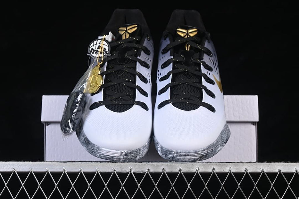 Front view of the pair with black laces and gold tongue emblems