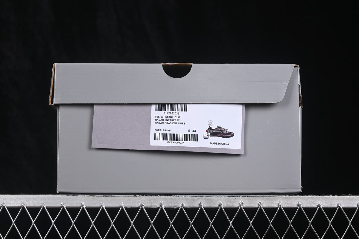 Gray shoe box with a product label showing Radar sneaker details, purple/pink color, and sample size EU 43.