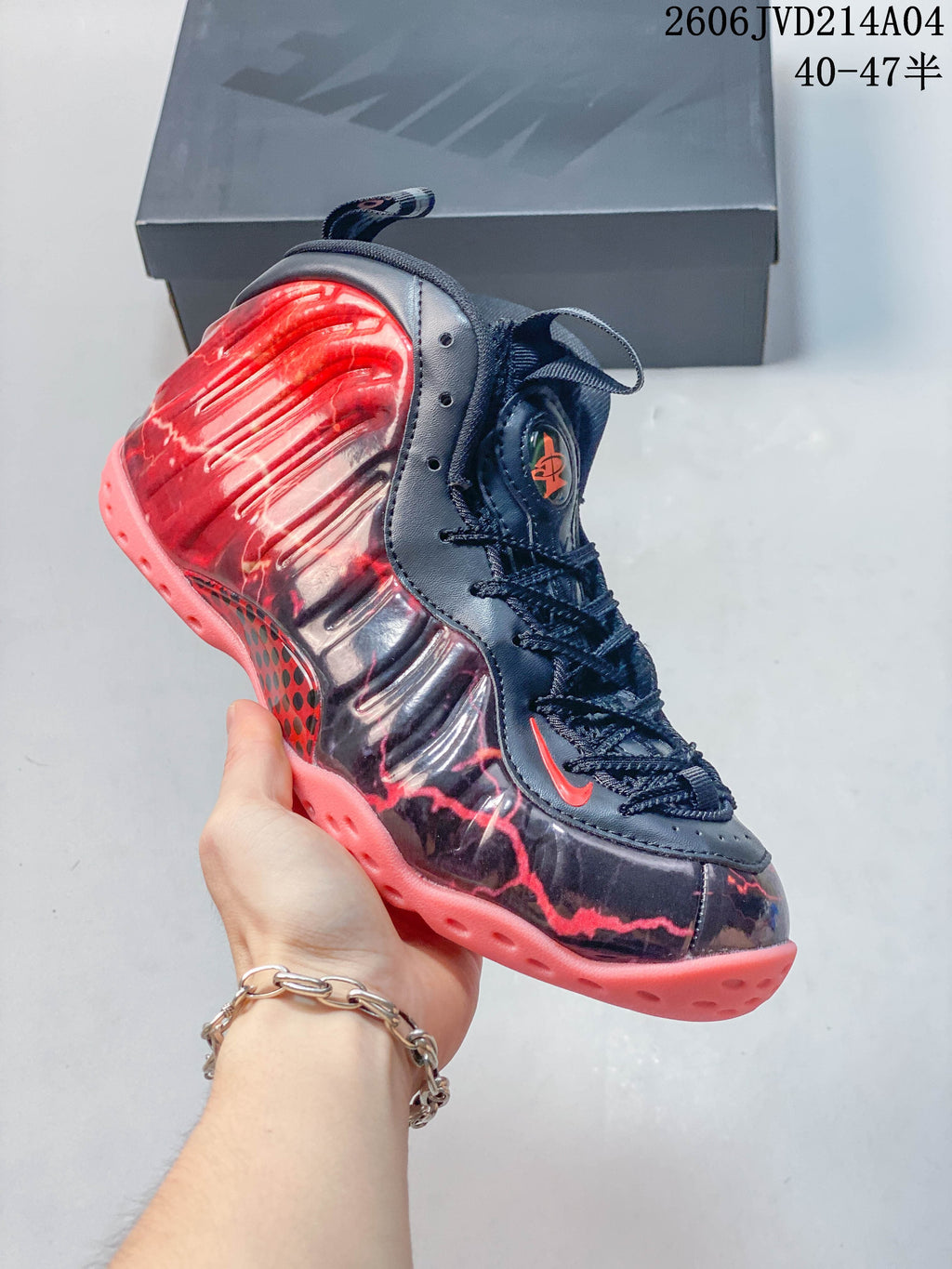 Side profile showing the sculpted upper and contrasting coral outsole.
