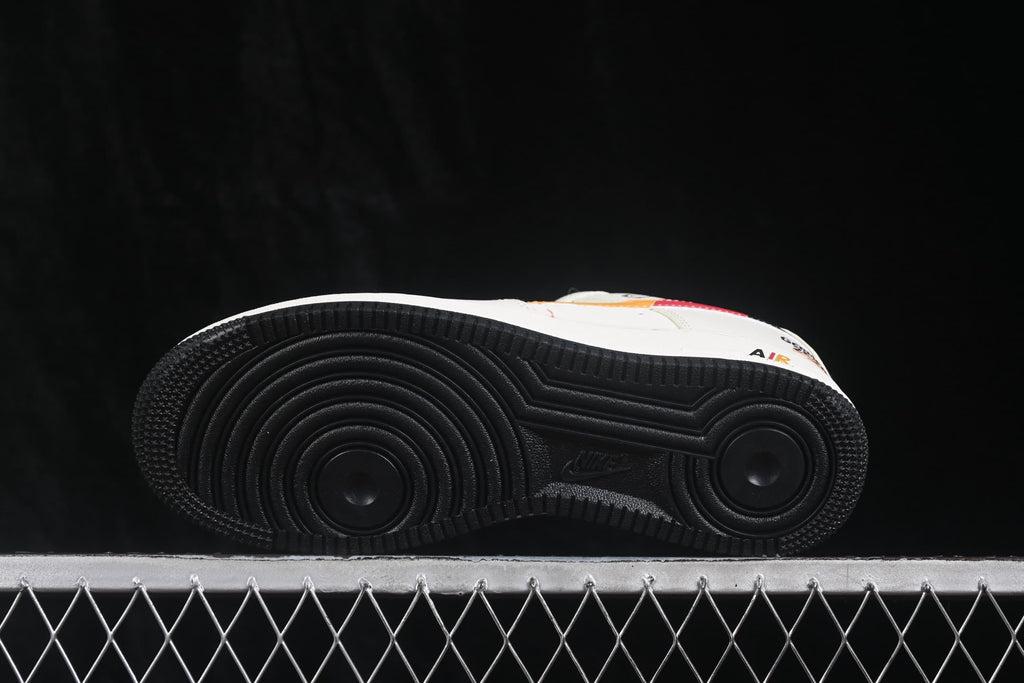 Underside view showing the black circular-pattern rubber outsole and Air branding.