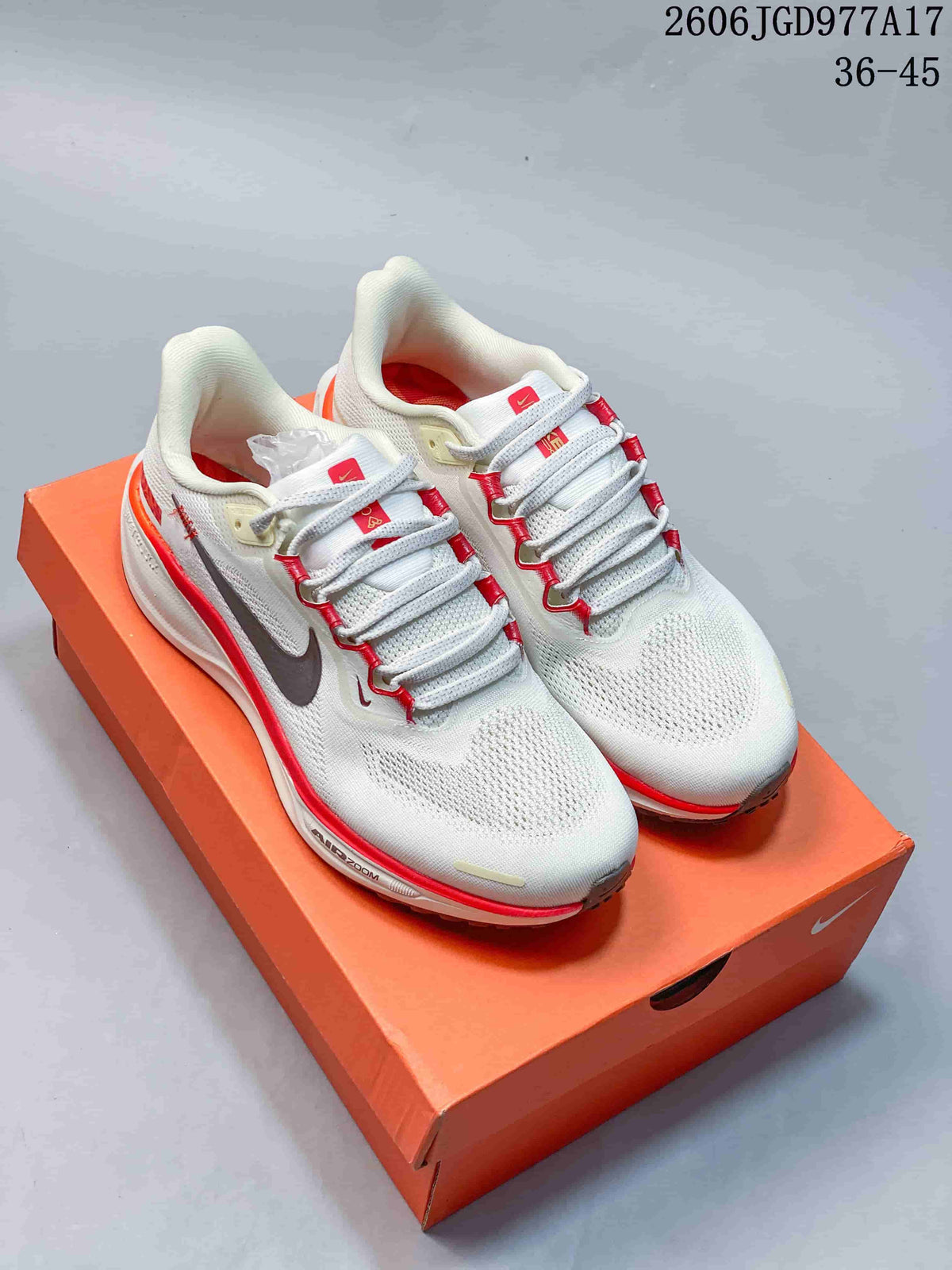 Pair of light Pegasus 41 shoes with red lace accents and dark Swooshes