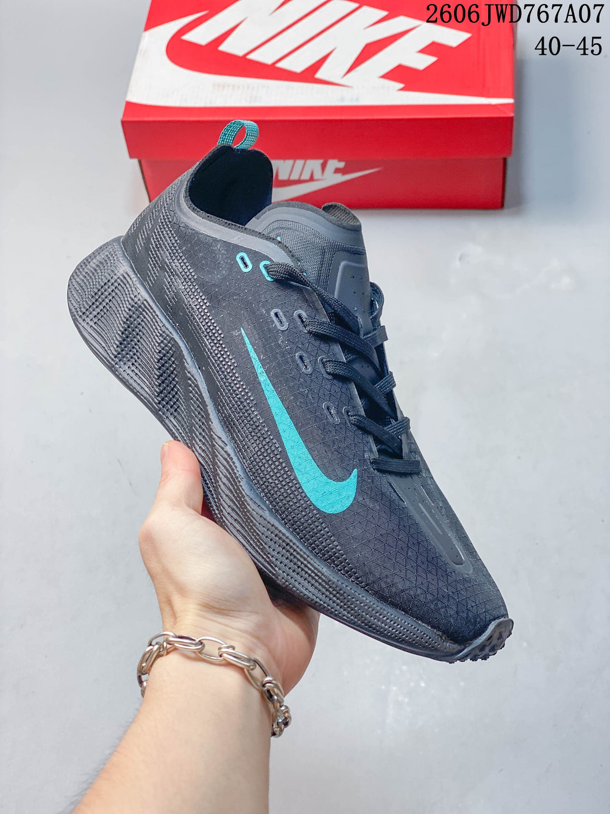 Angled side view of the shoe with teal accents