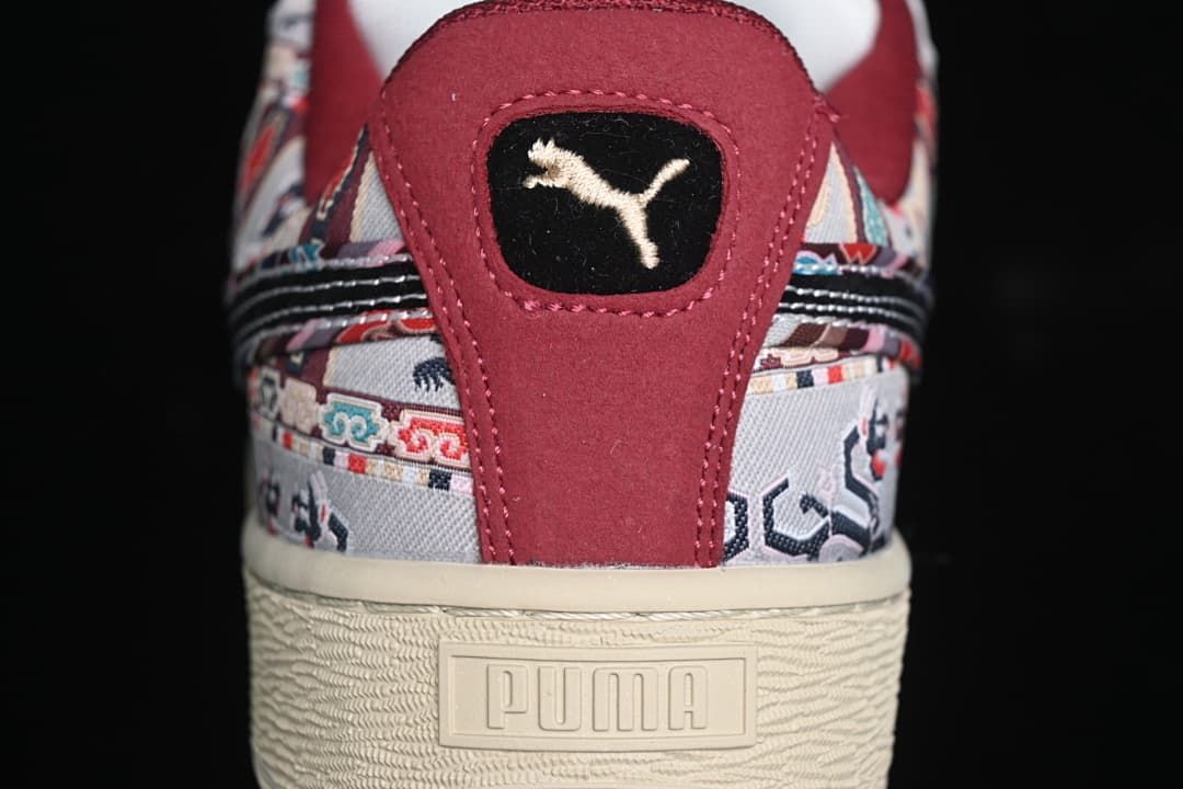Rear view showing the patterned upper, burgundy heel panel, and cream sole