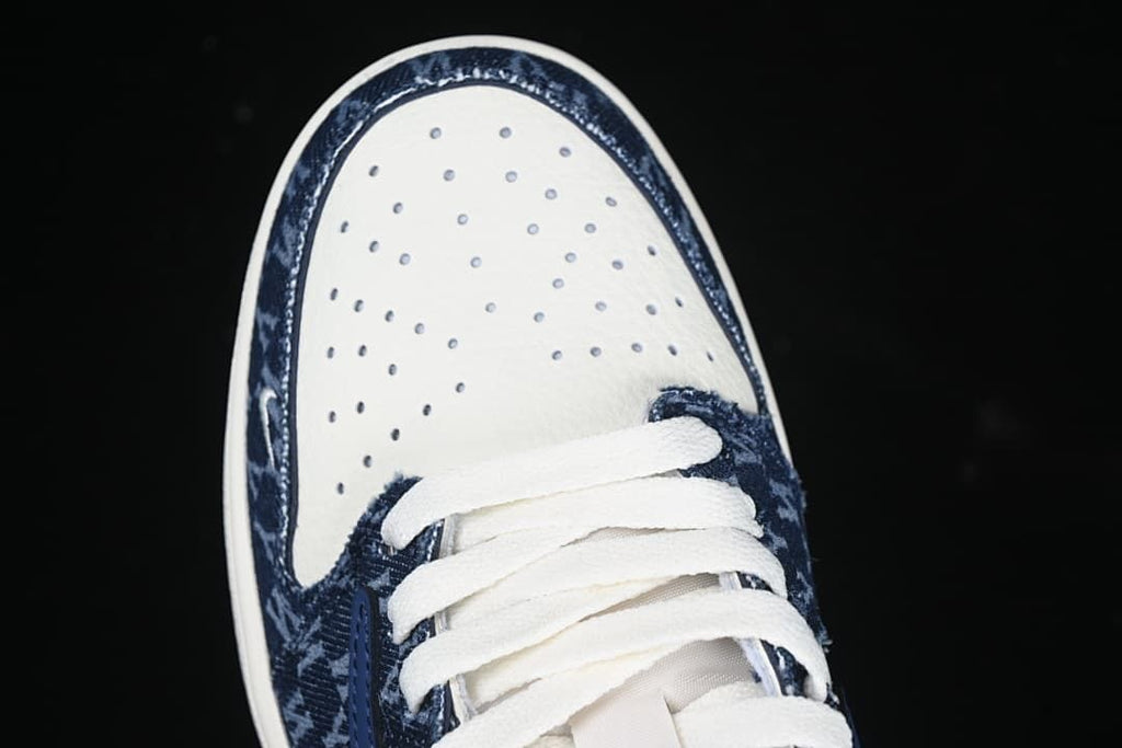 Top view of the perforated toe panel and laces