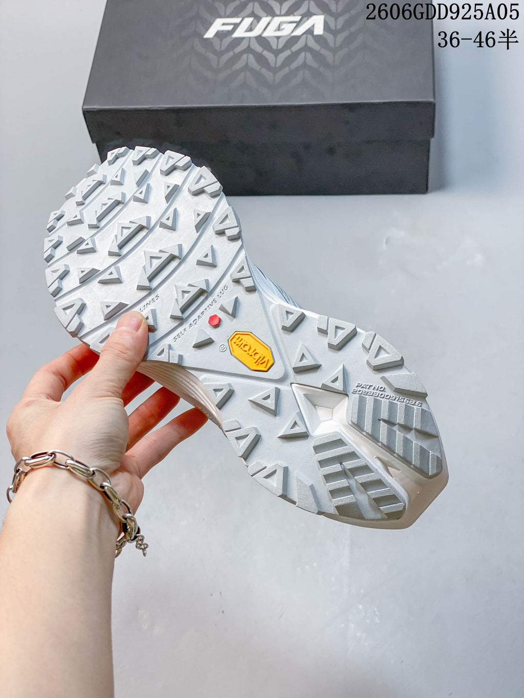 Close-up of the lugged outsole with Vibram branding.
