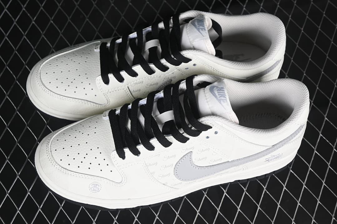 Pair of white and grey low-top sneakers viewed from above.