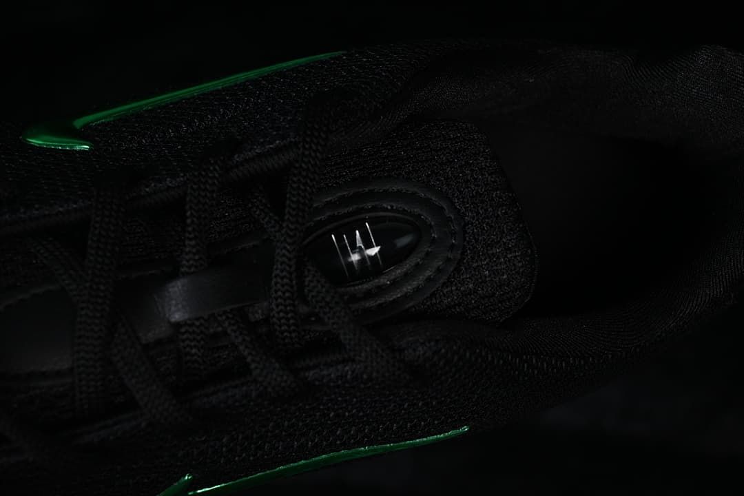 Close-up of black laces and tongue detail on the sneaker.