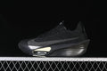 Side view of a black Nike Alphafly 3 running shoe with pale yellow sole accents