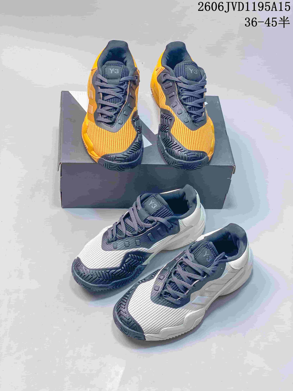 Orange and white colorways of Y-3 Barricade 13 sneakers shown together.