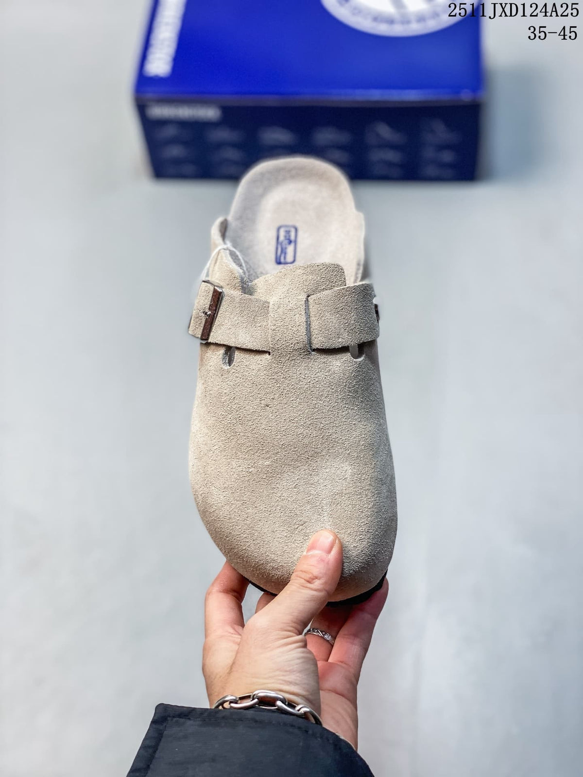 Top view of a taupe closed-toe clog with a wide adjustable buckle strap