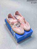 Pair of pink Adidas Samba Jane Mary Jane-style sneakers with gum-colored soles