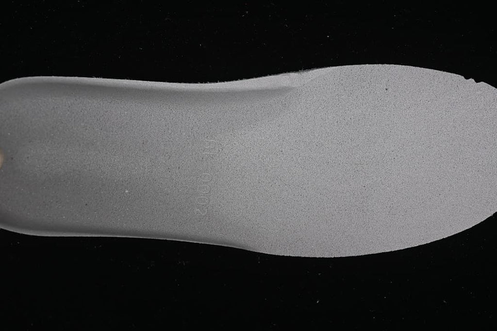 Close-up view of the sneaker's light-colored insole