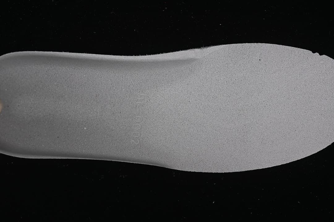 Close-up view of the sneaker's light-colored insole