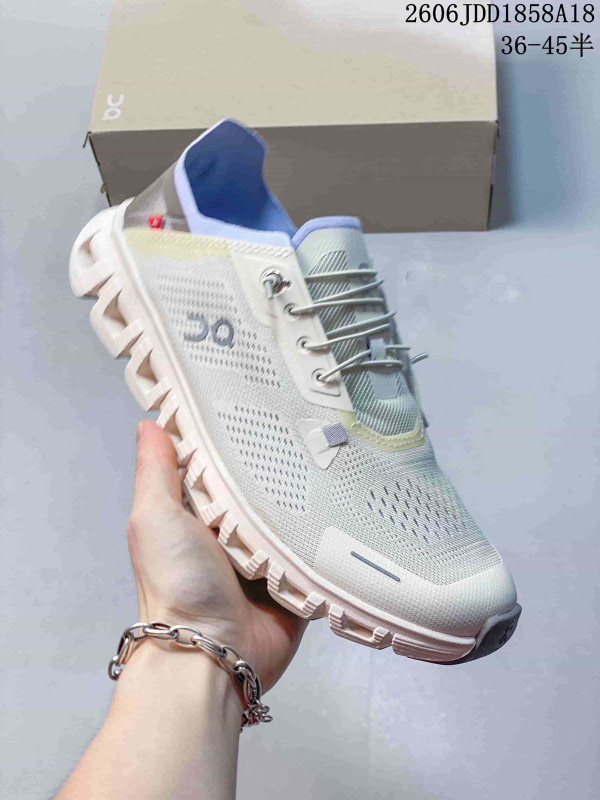 Angled view of the light-colored On Cloud 6 Coast sneaker
