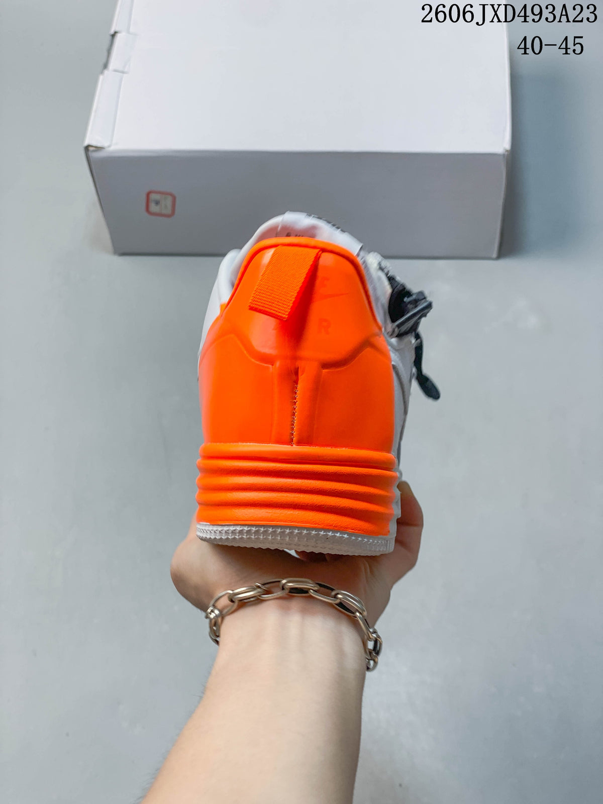 Rear view showing the bright orange heel panel