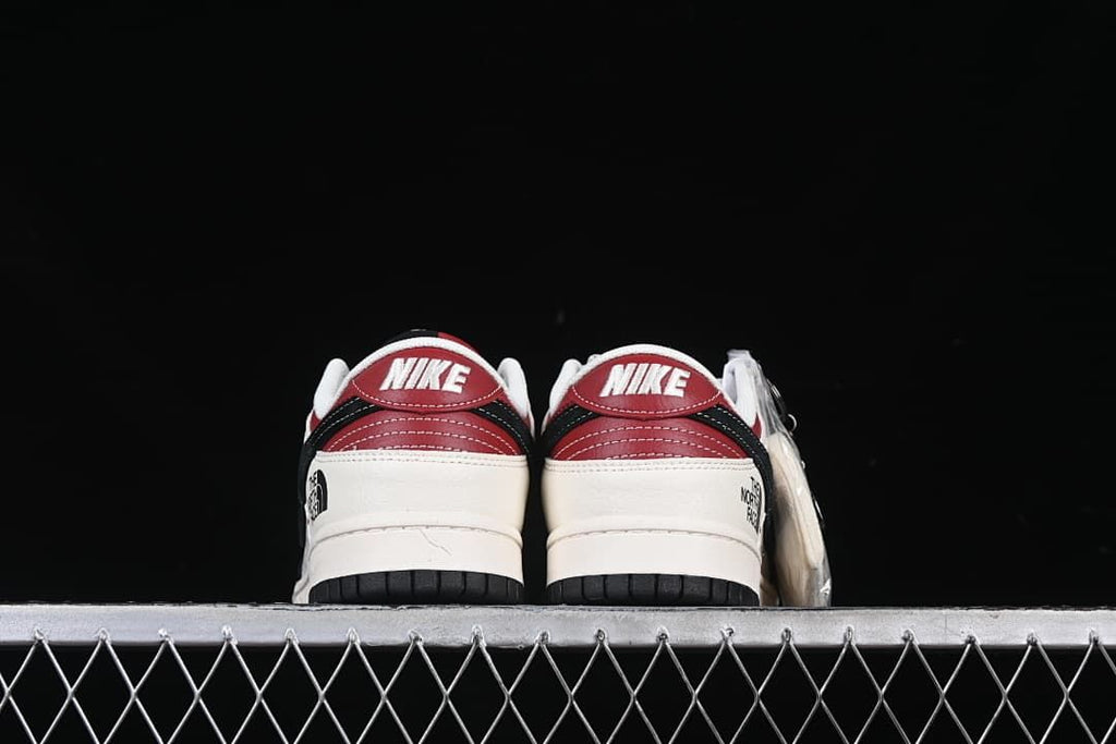 Rear view of both shoes showing red heel panels