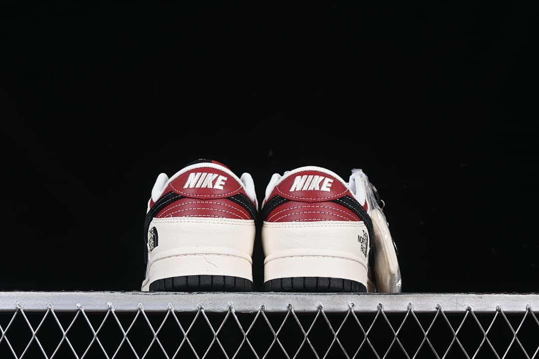Rear view of both shoes showing red heel panels