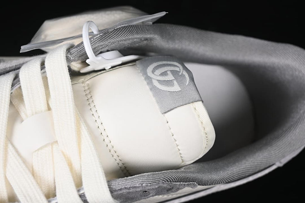Close-up of the tongue, laces, and gray collar lining