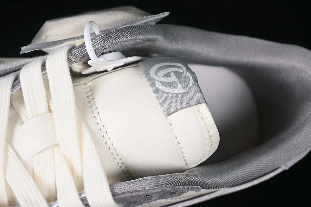Close-up of the tongue, laces, and gray collar lining