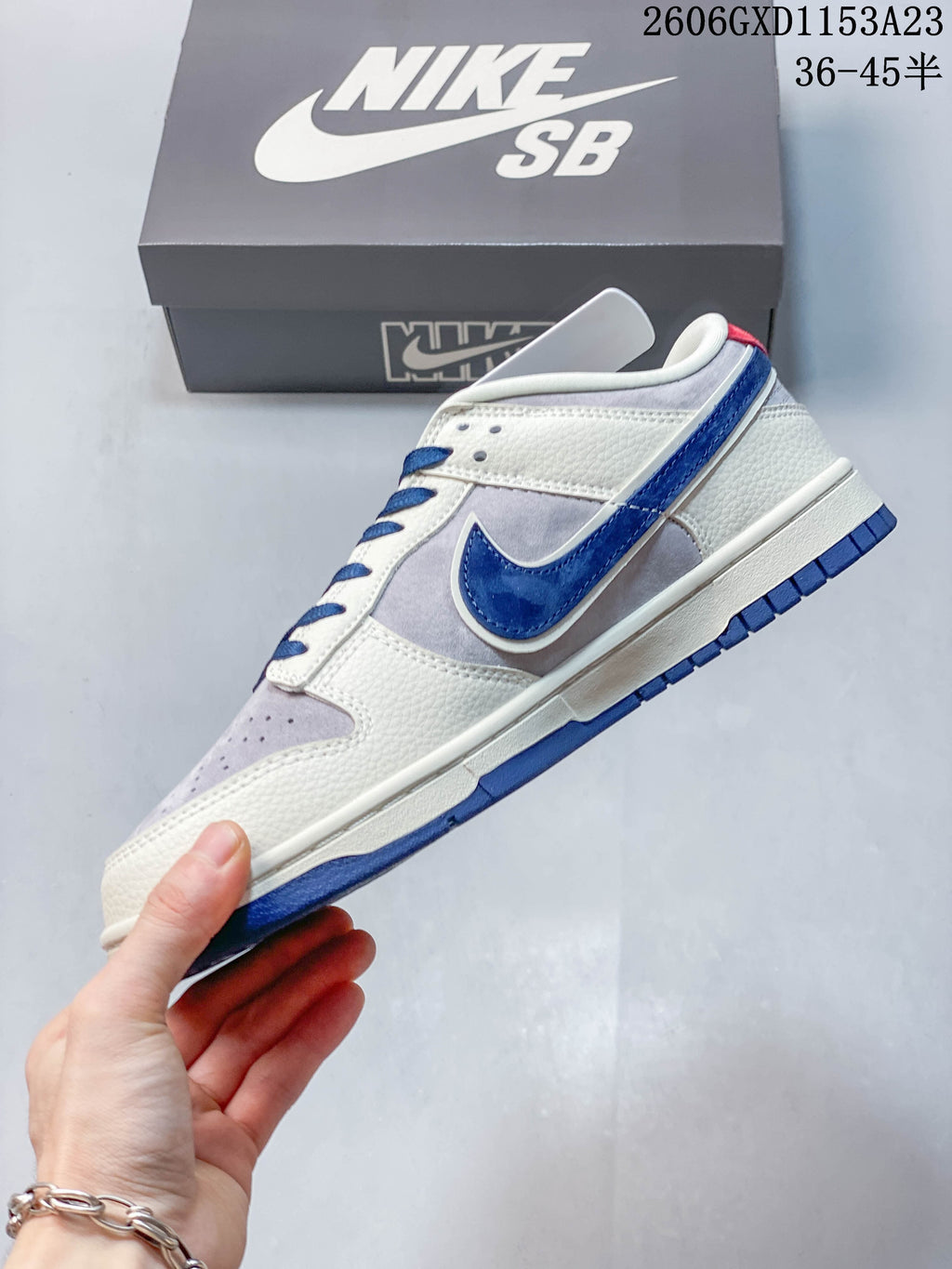 Side profile showing cream and gray panels, blue accents, and a low-top silhouette.