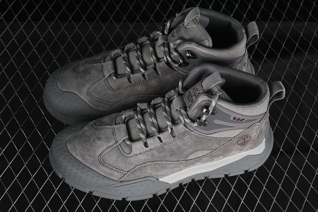 Pair of gray mid-top shoes shown from above at an angle