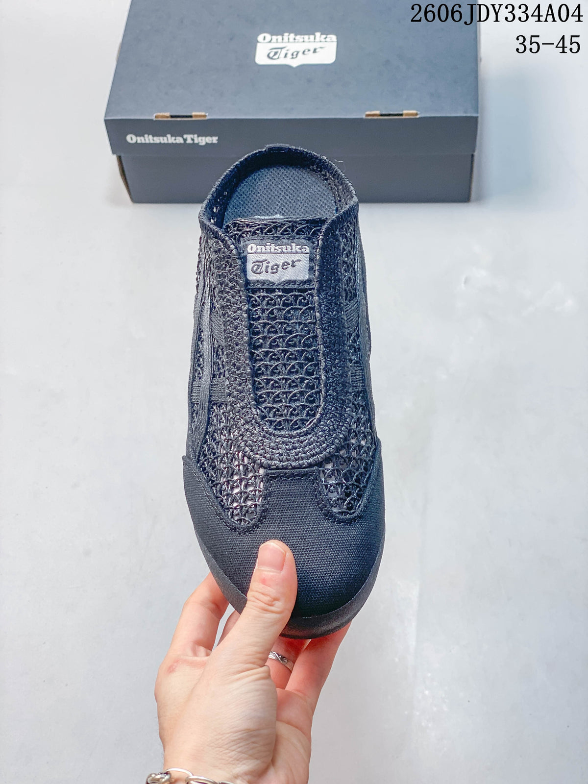 Front view of a dark navy Onitsuka Tiger slip-on shoe with patterned upper.