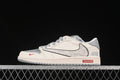 Side view of a grey and off-white low-top sneaker with a patterned side overlay