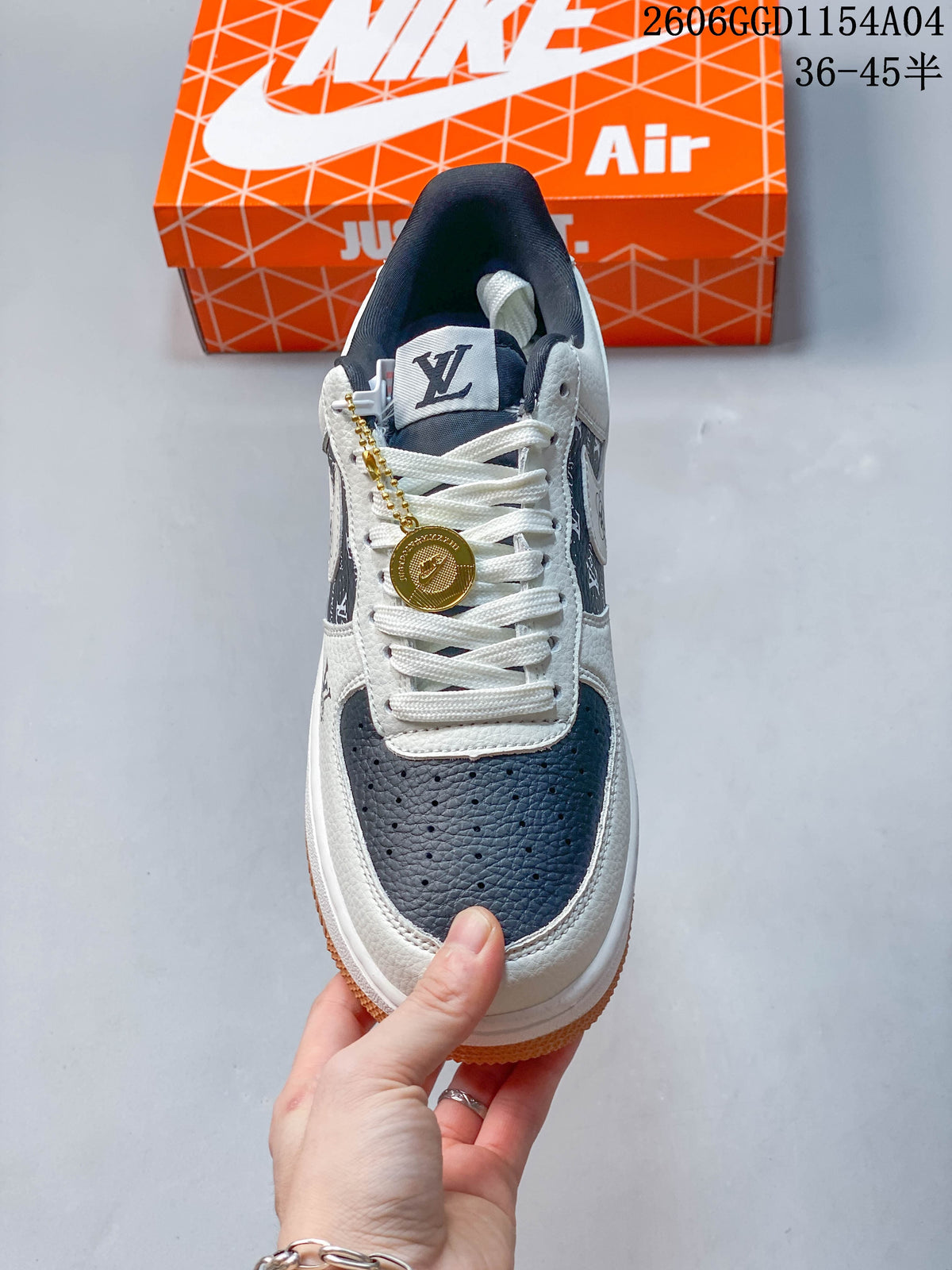 Front view highlighting the perforated navy toe, white laces, and gold-tone charm.