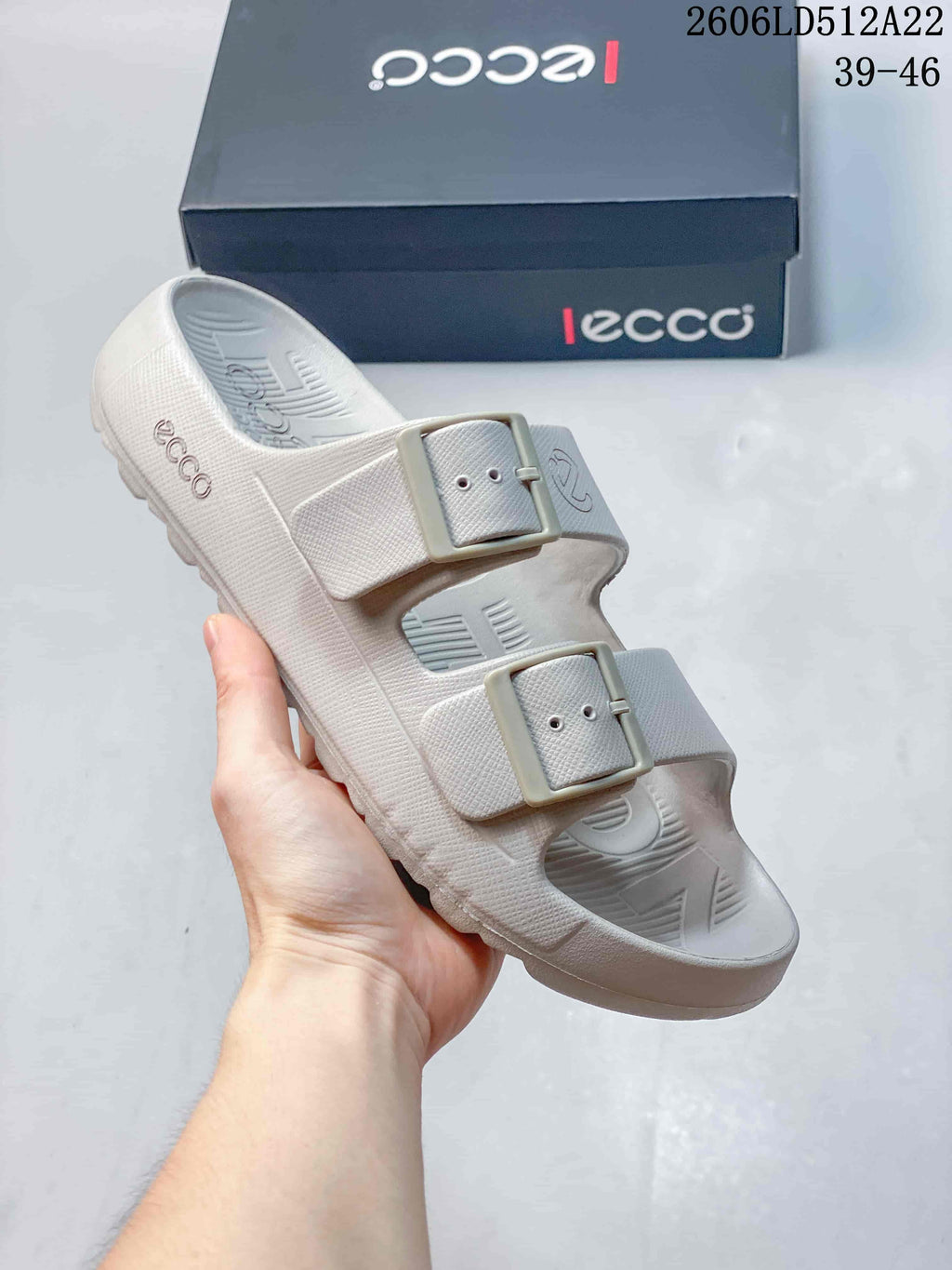 Angled close-up of the sandal's two buckle straps and contoured footbed