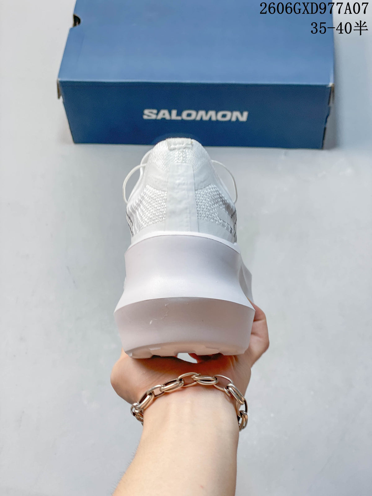 Rear view of a white sneaker with a thick sculpted platform sole.