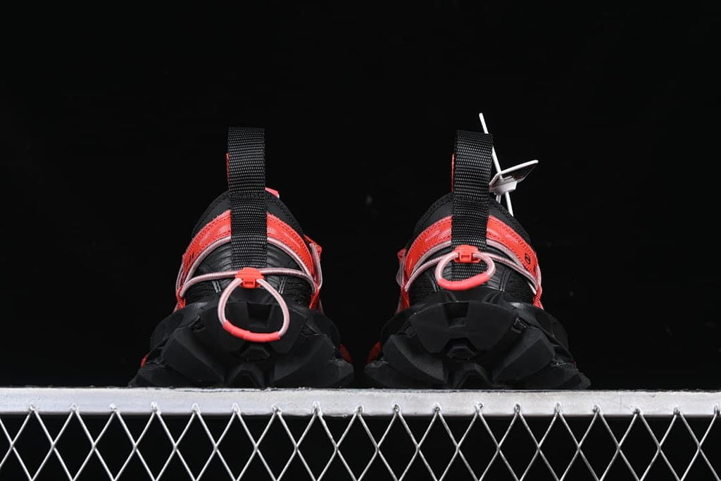 Rear view of both sneakers showing heel pull tabs and chunky soles