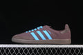 Side view of brown adidas Samba OG sneakers with blue stripes and laces.
